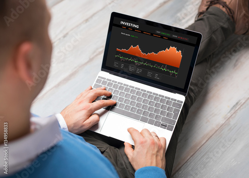 Investor using laptop photo