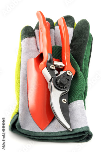 garden equipment like gloves shovel fork, scissors
