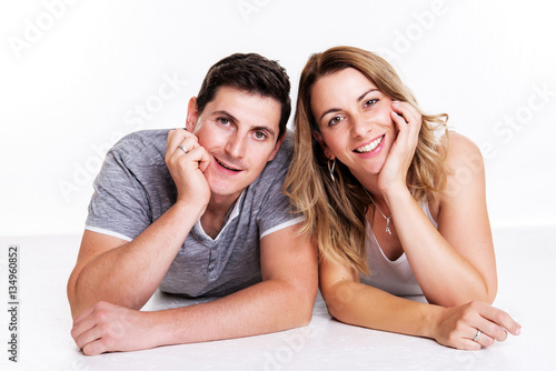 young couple in front of white background