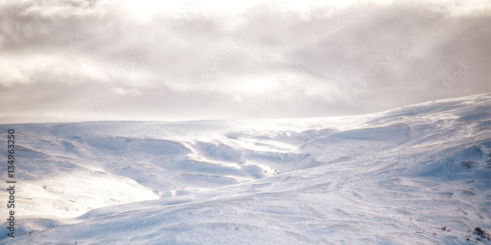 Snowy mountains with a fantastic sunlight.