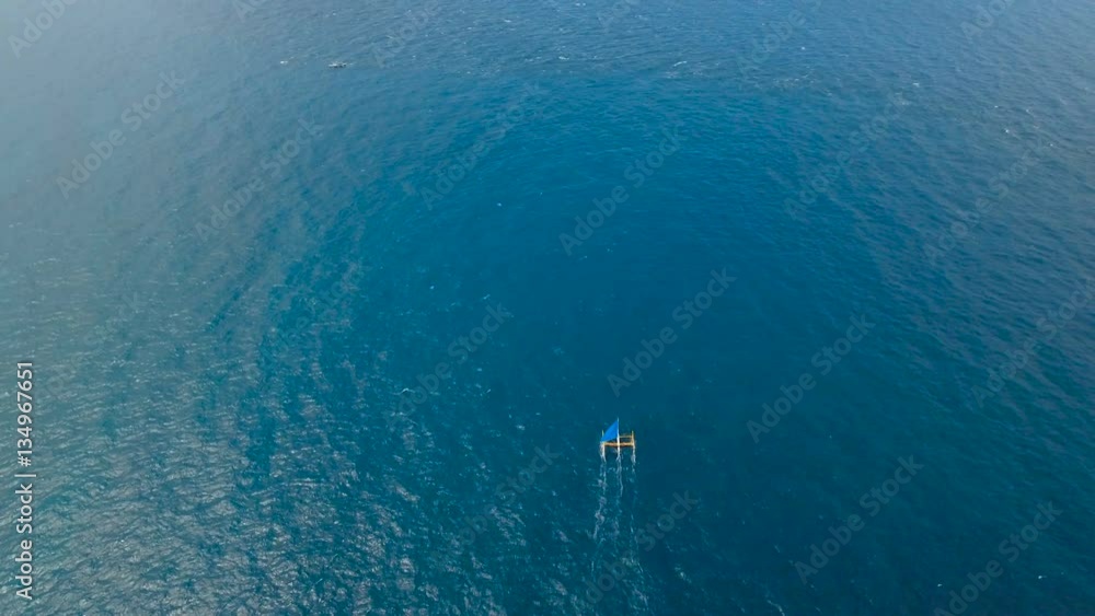 Sailing ship yachts with blue sails in the ocean.Aerial view:Sail boat on sea. Sailing ship yachts in the sea.Aerial video. Sailing boat in blue sea. Philippines, Boracay. 4K video. Travel concept Sailing ship yachts with blue sails in the ocean.Aerial view:Sail boat on sea. Sailing ship yachts in the sea.Aerial video. Sailing boat in blue sea. Philippines, Boracay. 4K video. Travel concept