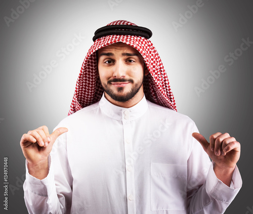 Fotografie Studio portrait of a condescending Arabian man