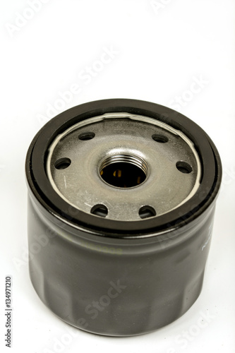 Black metal car oil filter isolated over white background