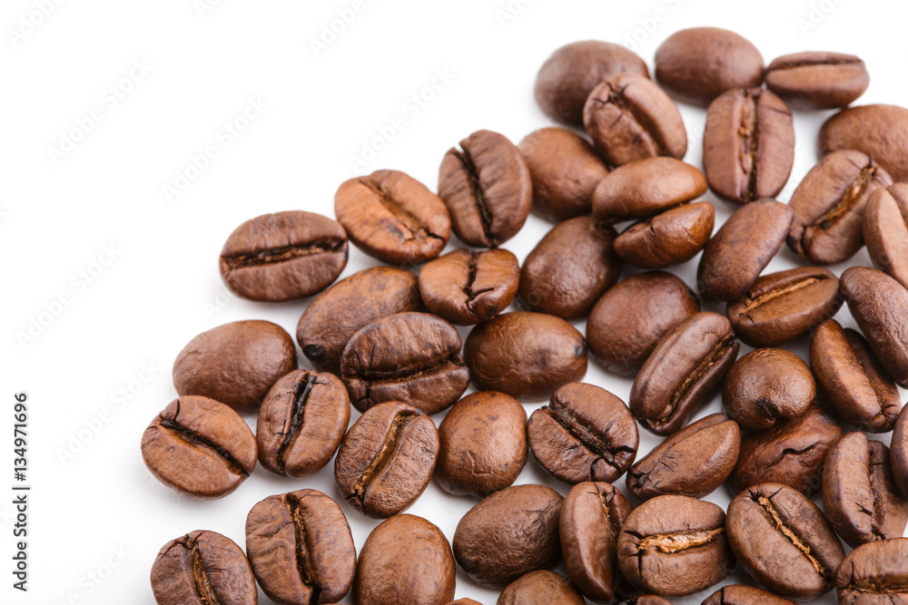 roasted coffee beans isolated in white background. Roasted coffee beans background close up. Coffee beans pile from top on white background with copy space for text. Good morning. roasted coffee beans isolated in white background. Roasted coffee beans background close up. Coffee beans pile from top on white background with copy space for text. Good morning.