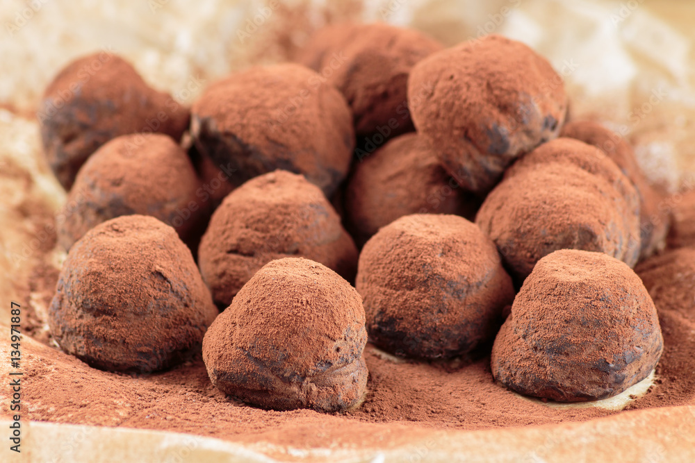 Chocolate truffles filled with caramelized hazelnut chips and cowered with cocoa powder Chocolate truffles filled with caramelized hazelnut chips and cowered with cocoa powder