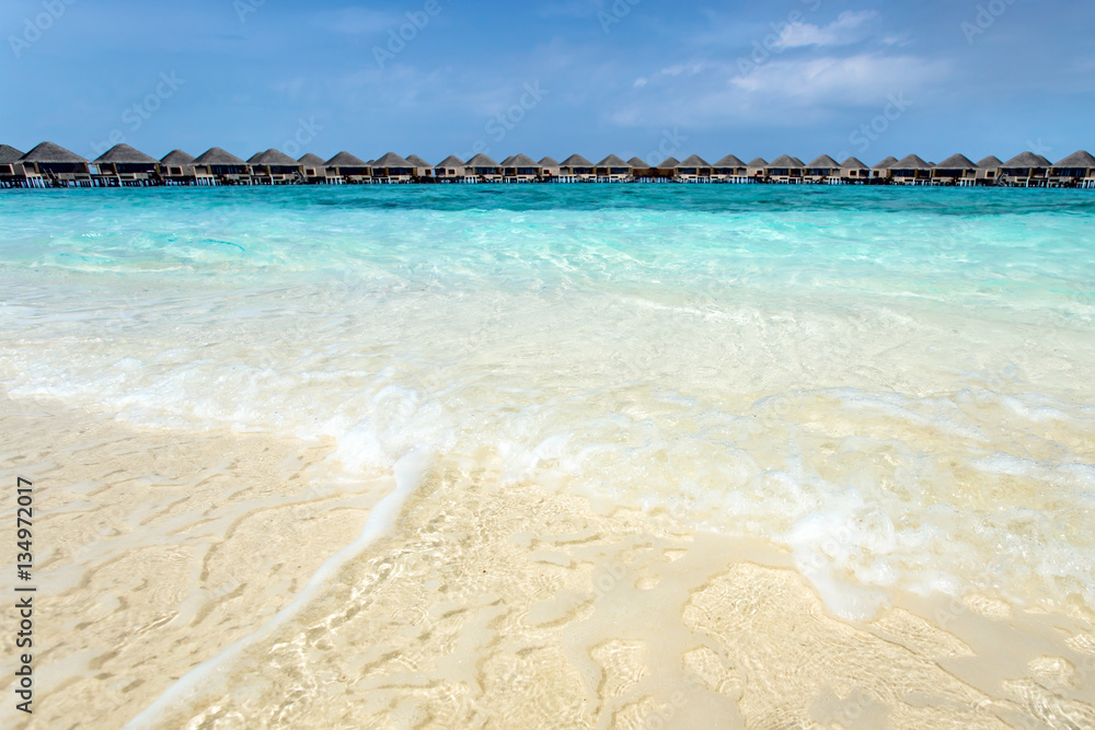 Fototapeta premium Water bungalows resort at islands. Indian Ocean, Maldives