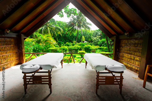 Spa beds ready to massage at outdoors tropical island resort