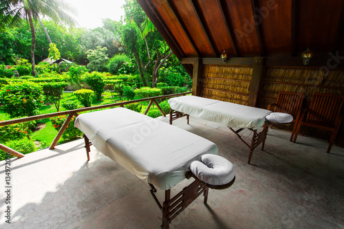 Spa beds ready to massage at outdoors tropical island resort