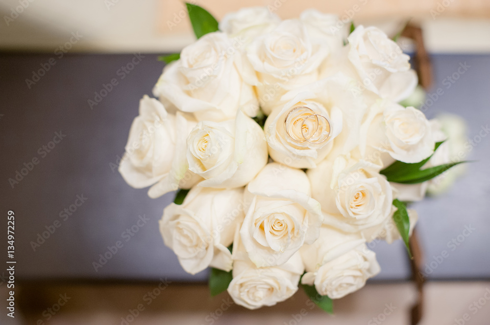 bridal bouquet and newlyweds rings. bridal bouquet and newlyweds rings.