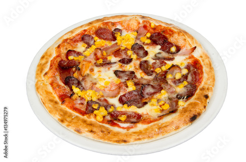 Pizza on a white background with tomato sauce, cheese, sausage, tenderloin and corn.