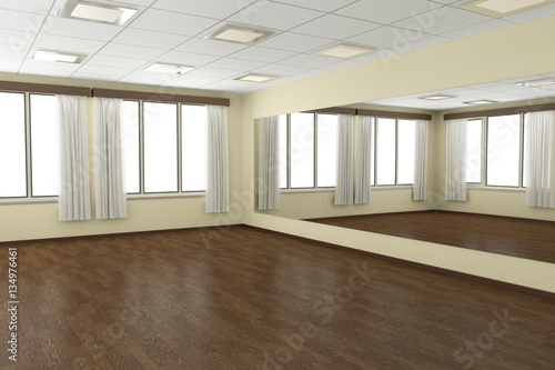 Empty training dance-hall with yellow walls and dark wooden floo