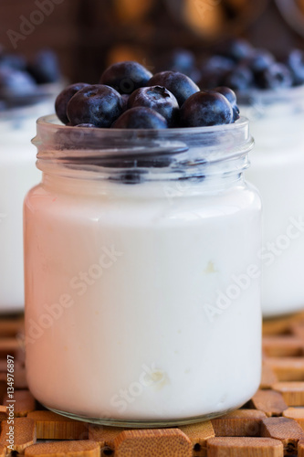 Yogurt with berries in a glass jar