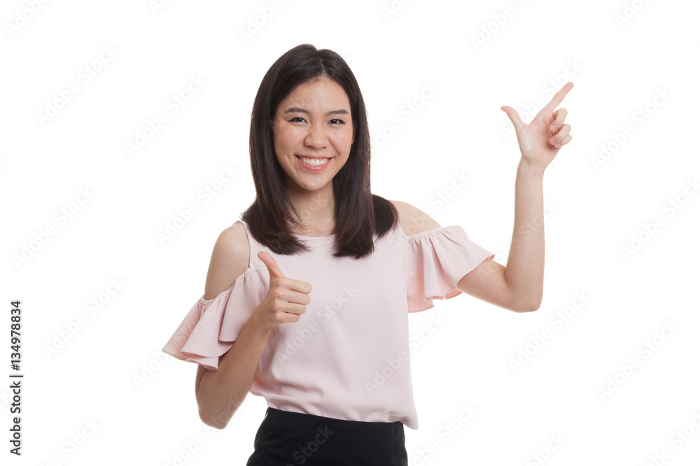 Young Asian business woman point and thumbs up. Young Asian business woman point and thumbs up.