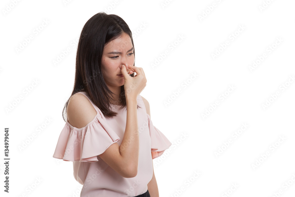 Young Asian woman holding her nose because of a bad smell. Young Asian woman holding her nose because of a bad smell.