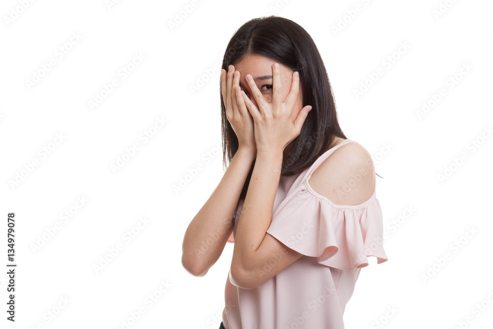 Beautiful young Asian woman peeking through fingers. Beautiful young Asian woman peeking through fingers.
