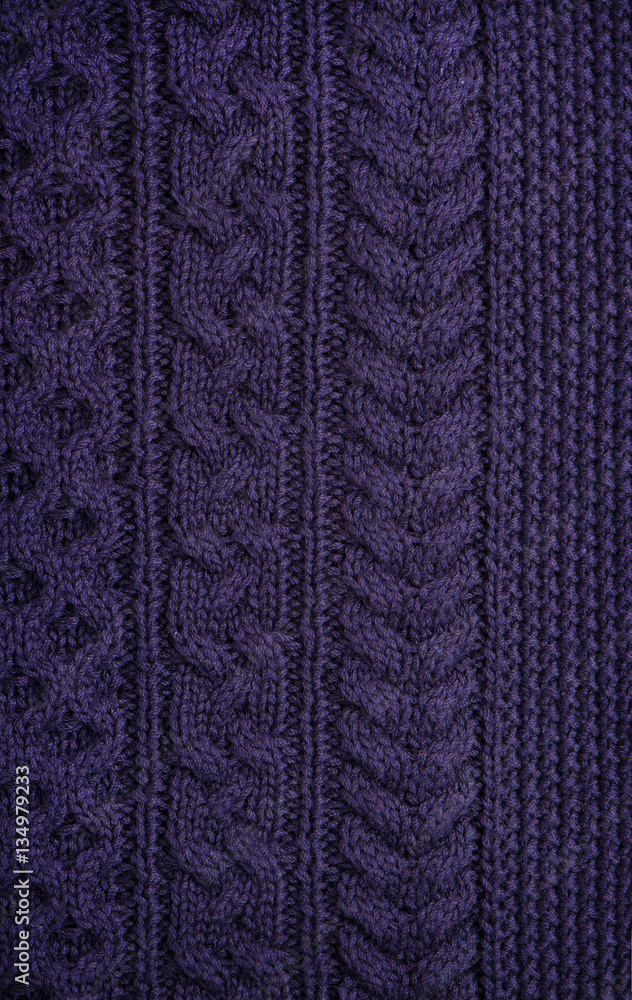 The texture of knitted woolen fabric blue. Unusual abstract background.