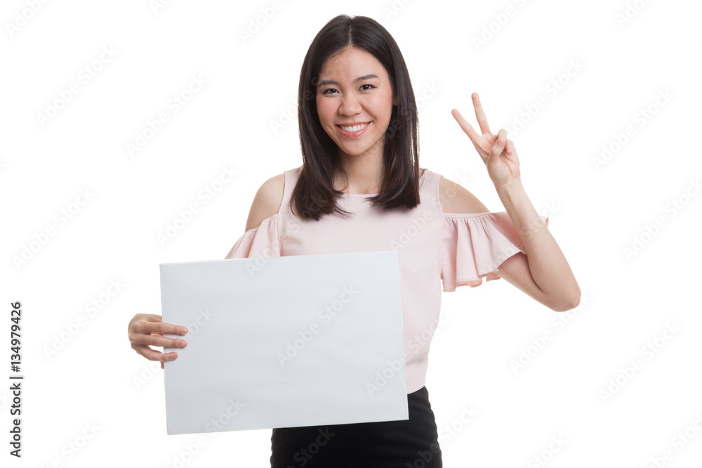 Young Asian business woman show victory sign with blank sign. Young Asian business woman show victory sign with blank sign.