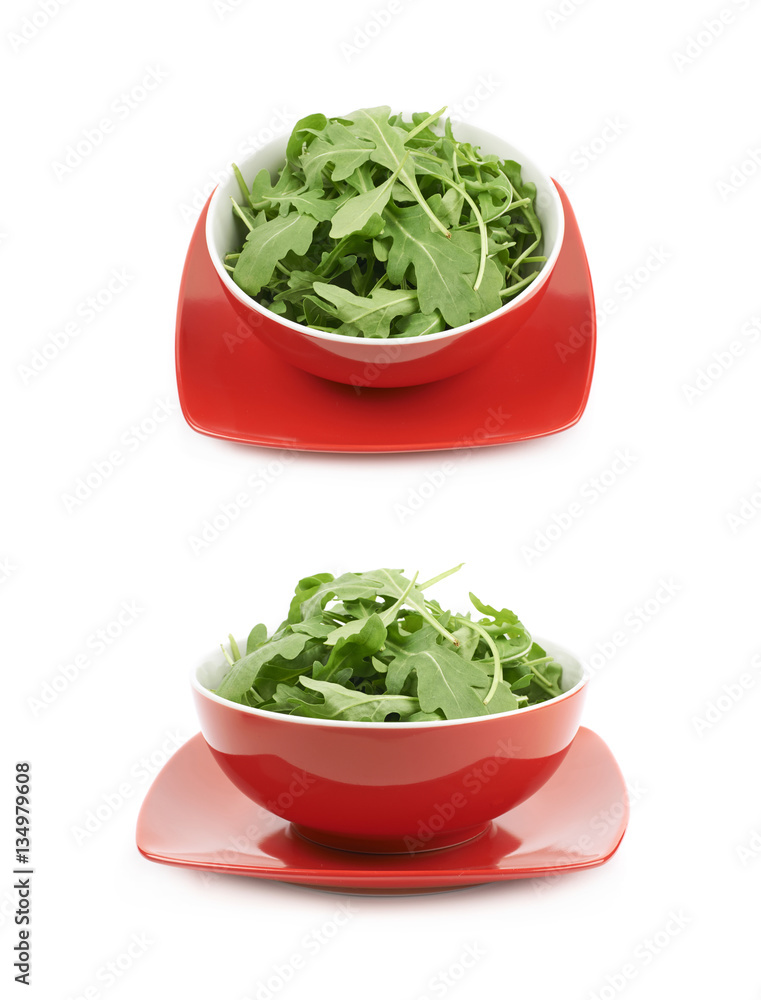 Bowl full of rocket salad leaves isolated Bowl full of rocket salad leaves isolated