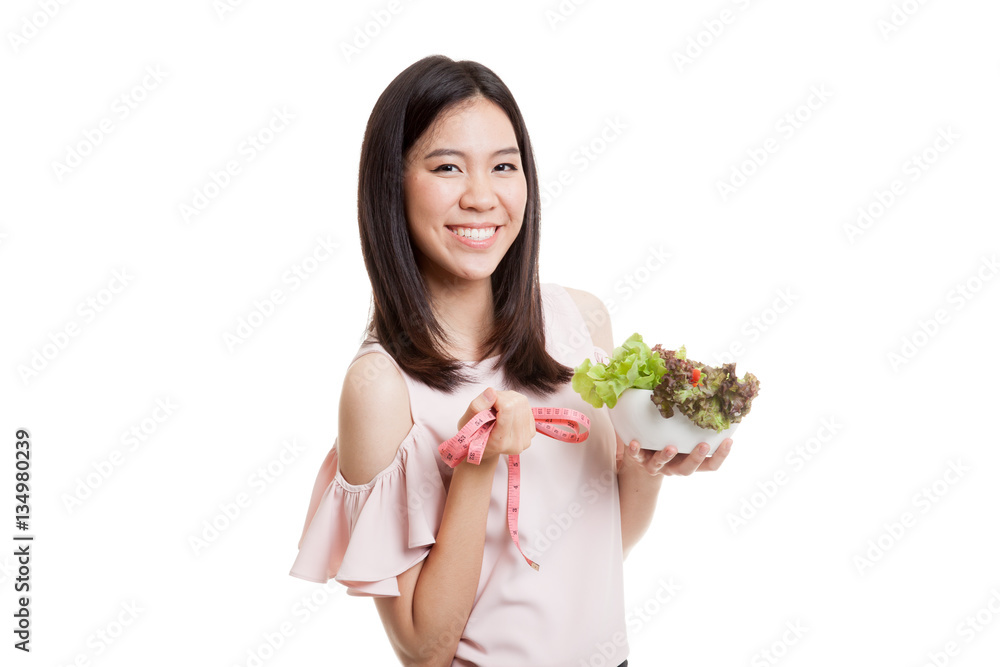 Healthy  Asian business woman with measuring tape and salad.