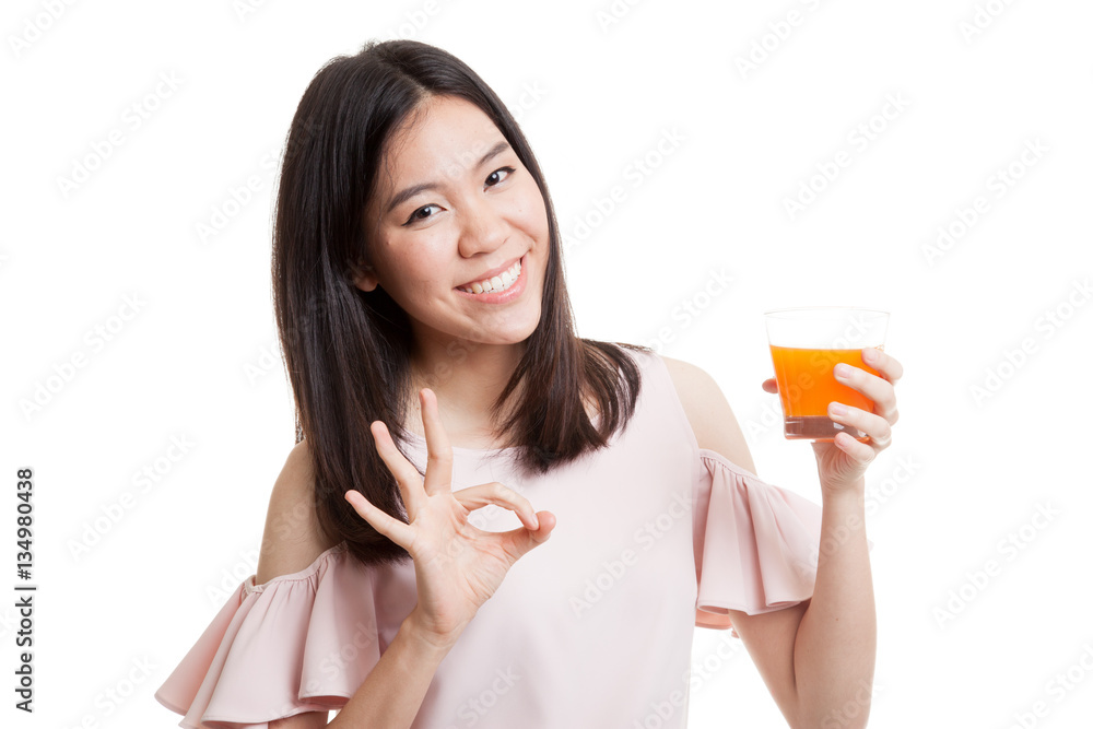 Young Asian woman show OK drink orange juice. Young Asian woman show OK drink orange juice.
