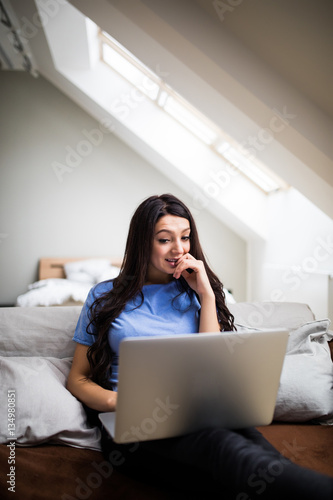 Girl watch movie on laptop