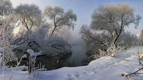 Winter river, foggy and frosty morning.
