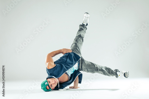 Man break dancer on white studio background
