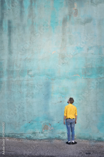 Man looking at the blue wall  © olly