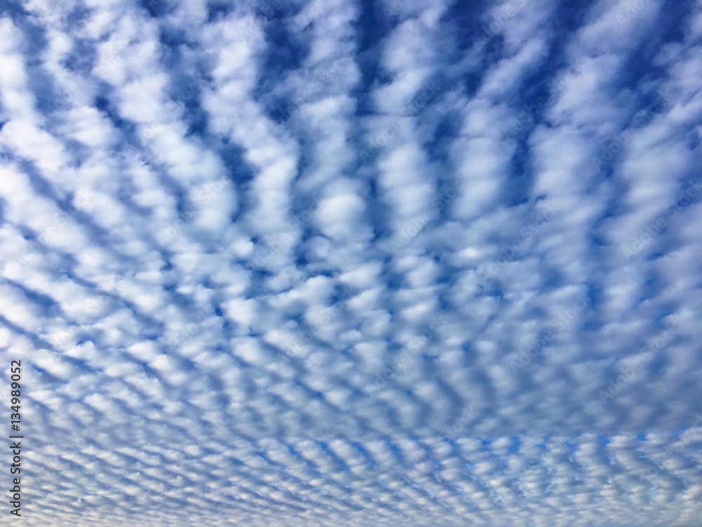 Cirrocumulus clouds form a herringbone or mackerel sky Stock Photo