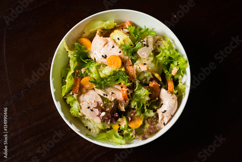 salad of chicken and vegetables with herbs