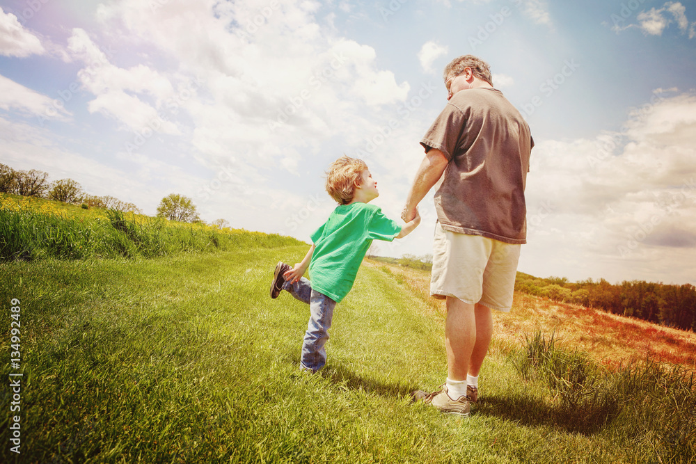 Fototapeta premium Father and son taking a walk outside, Instagram