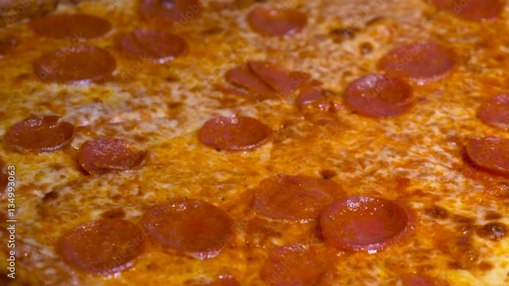 Close up of a delicious slice of home baked pepperoni cheese pizza Close up of a delicious slice of home baked pepperoni cheese pizza