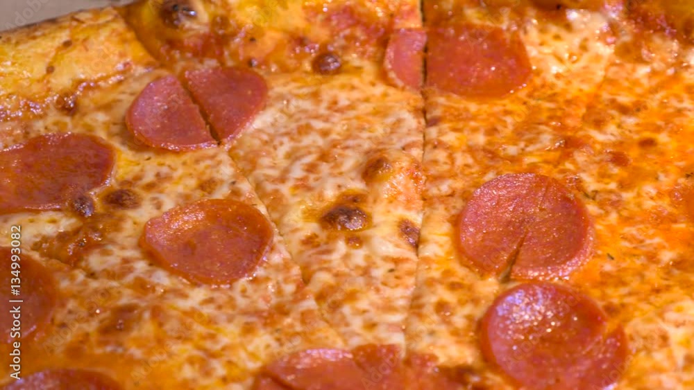 Close up of a delicious slice of home baked pepperoni cheese pizza Close up of a delicious slice of home baked pepperoni cheese pizza