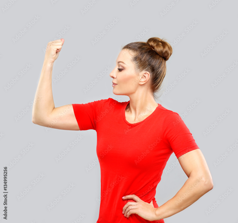 Fototapeta premium Portrait of woman tightens her fist, looking at camera.