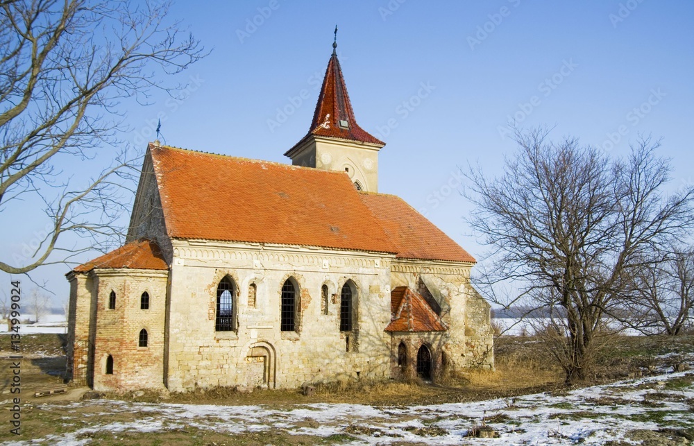 Abandoned church of St. Linhart on frozen Musov reservoir