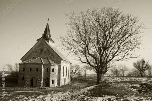 Abandoned church of St. Linhart on frozen Musov reservoir