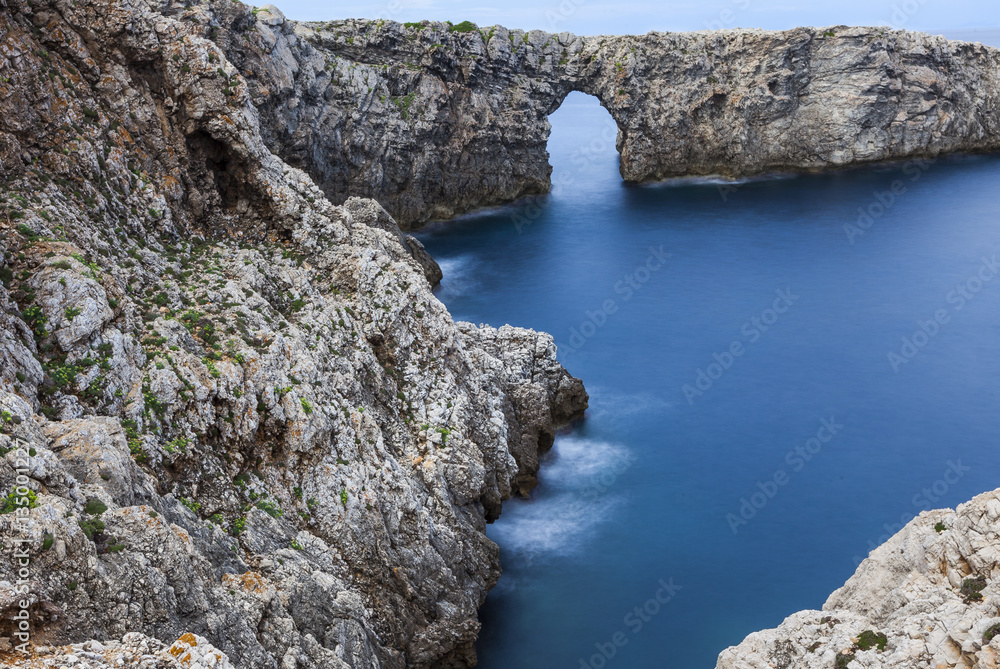 Natural stone bridge on the coast, north of Minorca, Balearic Islands, Spain