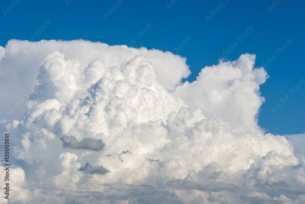 Cumulus clouds forming on a blue summer day Cumulus clouds forming on a blue summer day