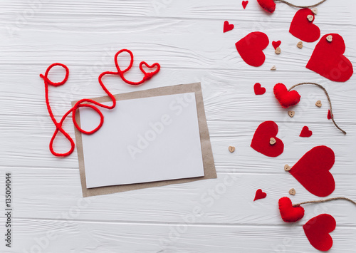 Valentine's Day. love letter, presents, heart felt and decor on wooden background