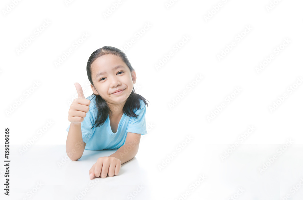 Portrait of smile Asian little girl showing thumb up with copy s Portrait of smile Asian little girl showing thumb up with copy s