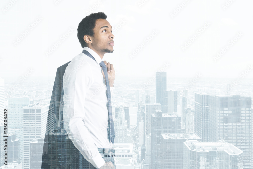 Side view of an African man and a cityscape Side view of an African man and a cityscape