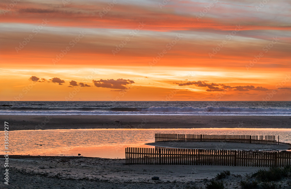 Fototapeta premium Orange sunset in Tarifa, Spain.