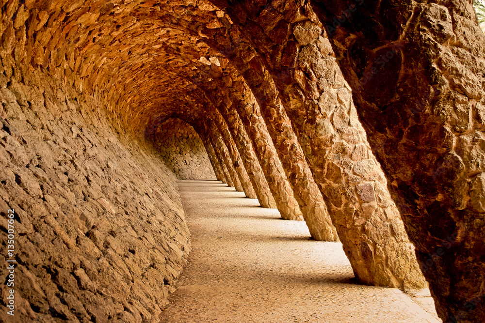 Stone walkway in the Park Guell in Barcelona, Spain. - obrazy, fototapety, plakaty 