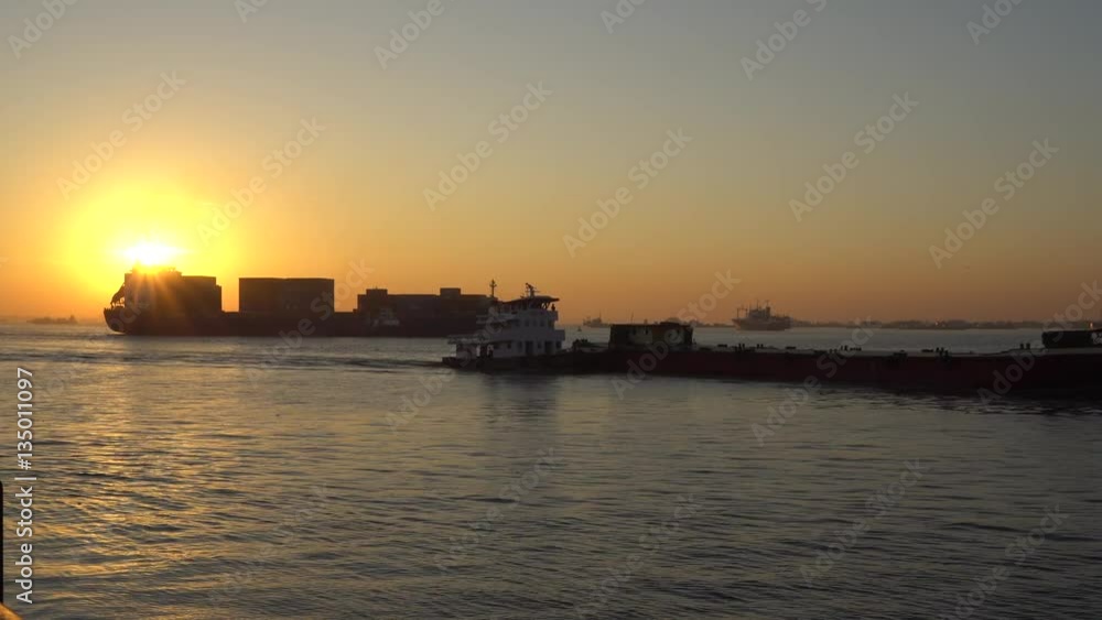 Sunrise and Cargo ship at the Yangon river in morning ,Yangon Myanmar Sunrise and Cargo ship at the Yangon river in morning ,Yangon Myanmar