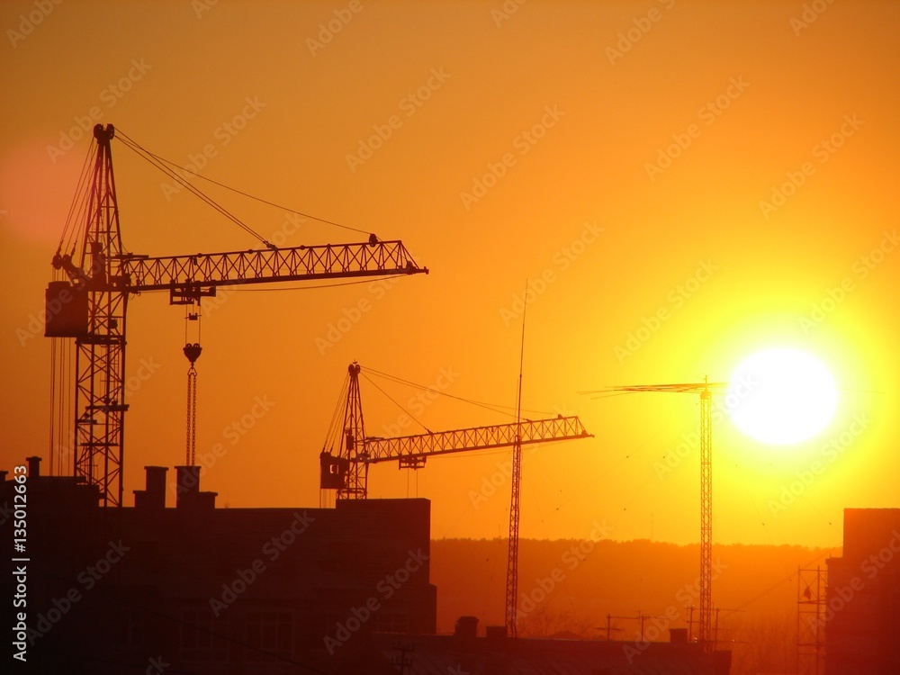 crane construction building sunset