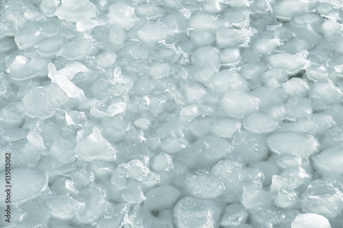 Tablou pe pânză Lumps of snow and ice frazil on the surface of the freezing rive