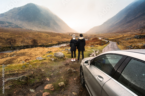 Young couple is relaxing and enjoying the view of mountain filmi photo