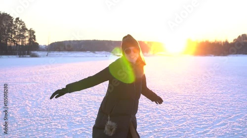 Sunny Winter Joyful Girl running in winter park. Snow. Happiness Slow Motion video