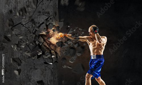 Fototapeta Naklejka Na Ścianę i Meble -  Young boxer man . Mixed media . Mixed media