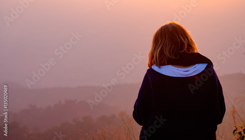 asian girl sitting alone  at mountain